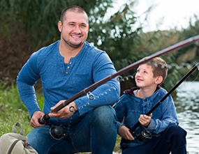 Father and son covered by CareFirst family plan fishing