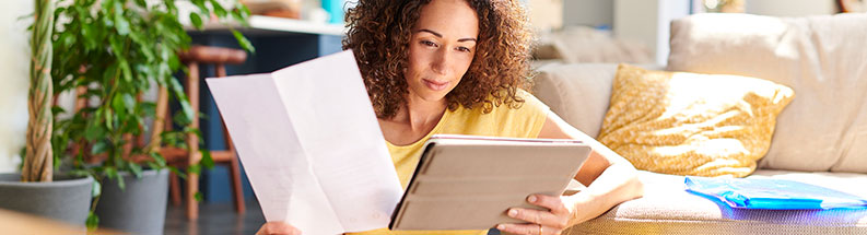 Woman ACA member reviewing information on tablet