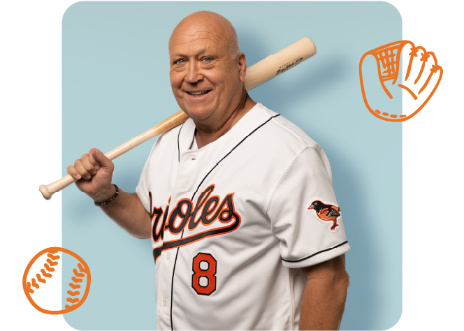 Cal Ripken holding a baseball bat posing