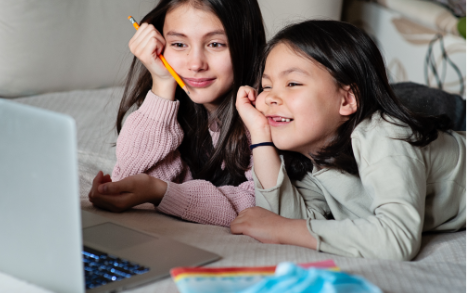 Sisters on Laptop