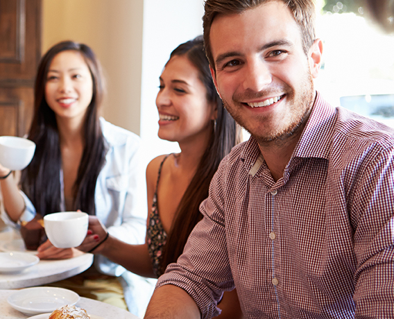 Group of people drinking coffee.