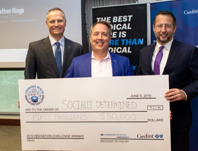 CareFirst President & CEO Brian D. Pieninck (left) and LifeBridge Health Senior Vice President Dr. Jonathan Ringo (right) with Socially Determined CEO Trenor Williams (center). 