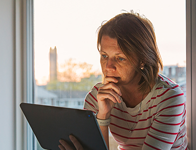 woman reading Ipad