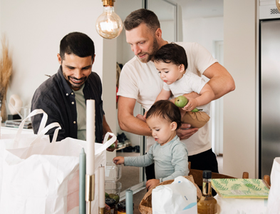 dads looking into bags with kids