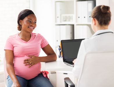 pregnant woman at doctor's office