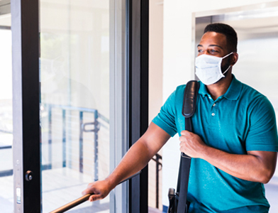 man opening door to work